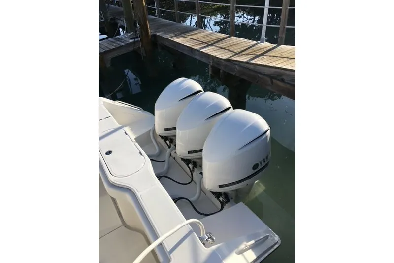 Slide: The Image of 2015 Jupiter 41 SB boat with triple Yamaha outboard engines at dock. - 6