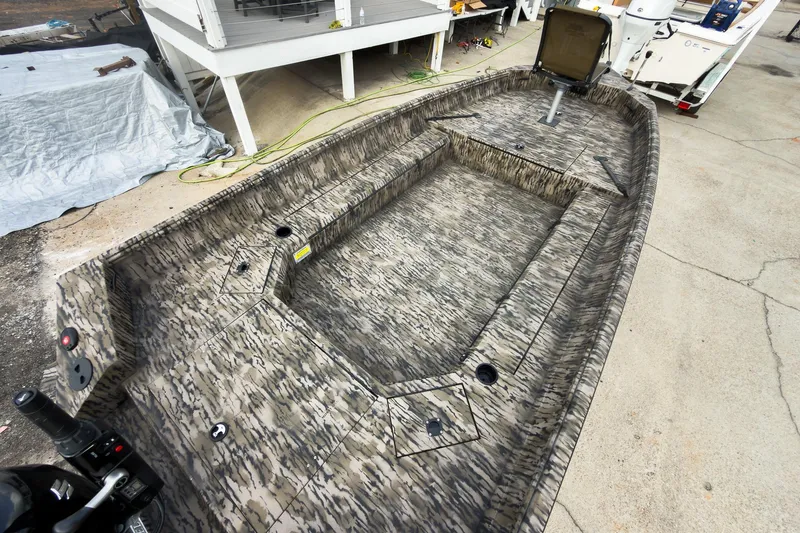 Slide: The Image of Camouflage interior of 2026 Excel 183 Tomahawk boat with control panel. - 12