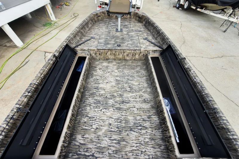 Slide: The Image of Open storage compartment in 2026 Excel 183 Tomahawk boat, showcasing interior space. - 16