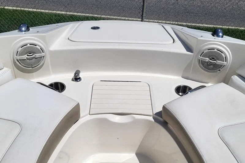 Slide: The Image of Interior view of a 2013 Sea Ray 260 Sundeck boat with speakers and seating. - 11