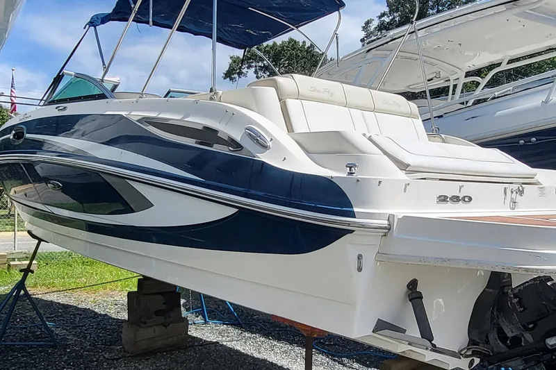 Slide: The Image of 2013 Sea Ray 260 Sundeck boat on display, featuring sleek design and comfortable seating. - 2