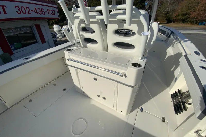 Slide: The Image of 2026 Cobia 285 Center Console boat interior with seating and storage compartments. - 12