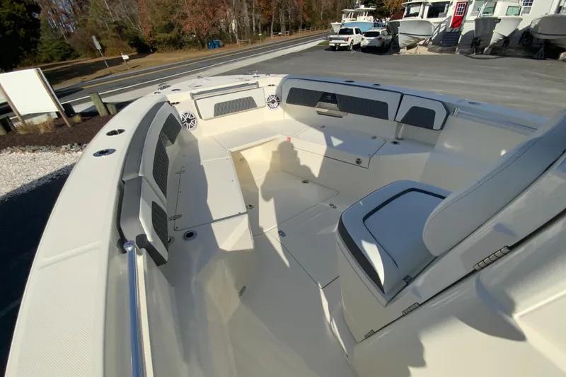 Slide: The Image of 2026 Cobia 285 Center Console boat interior with seating and storage compartments. - 29