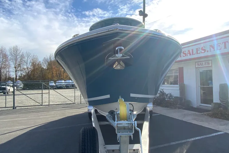 Slide: The Image of 2026 Cobia 285 Center Console boat on trailer in dealership lot. - 4