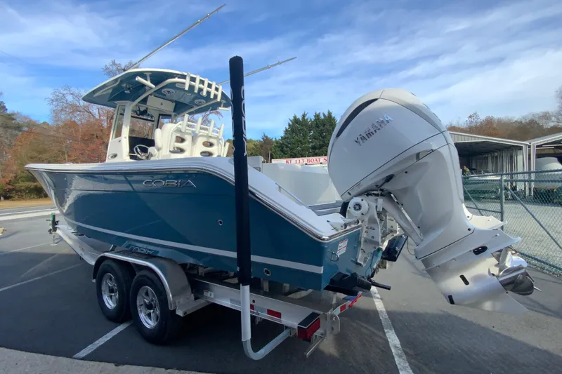Slide: The Image of 2026 Cobia 285 Center Console boat with Yamaha engine on trailer. - 7