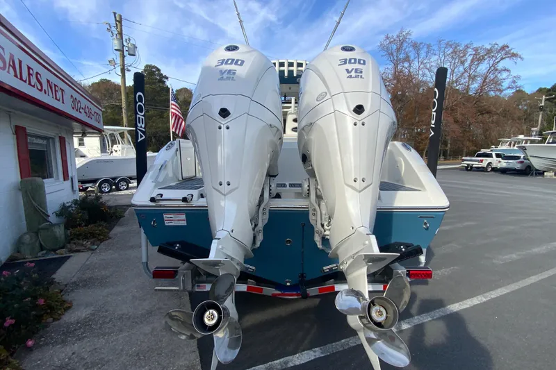 Slide: The Image of 2026 Cobia 285 Center Console with twin 300 V6 engines at a dealership. - 8