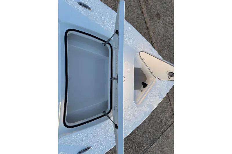 Slide: The Image of 2026 Blazer Bay 675 Ultimate Bay boat storage compartment open on deck. - 10
