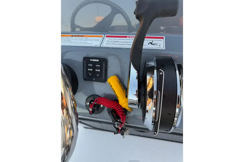 Slide: The Image of Control panel of 2026 Blazer Bay 675 Ultimate Bay boat with throttle and switches. - 15