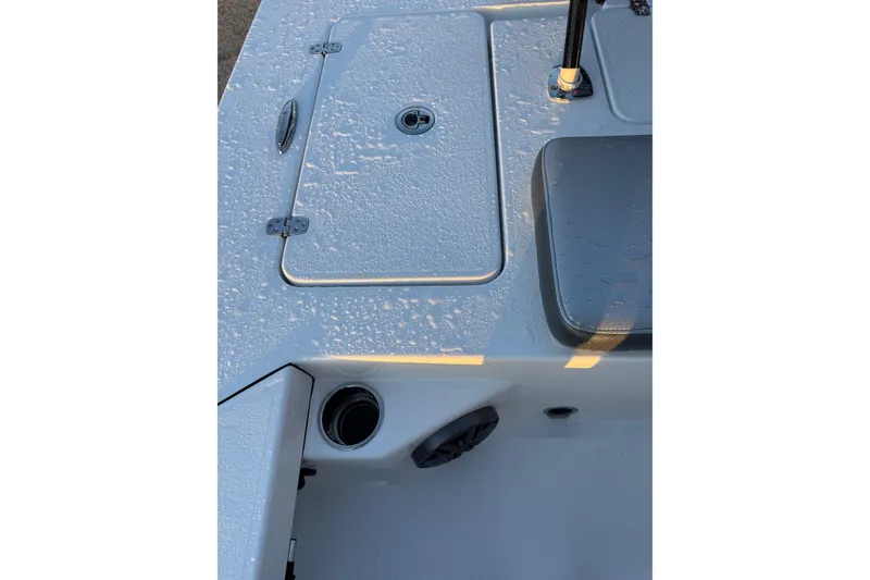 Slide: The Image of 2026 Blazer Bay 675 Ultimate Bay boat deck with storage compartment and seating. - 17