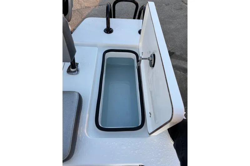 Slide: The Image of 2026 Blazer Bay 675 Ultimate Bay boat with open storage compartment. - 20