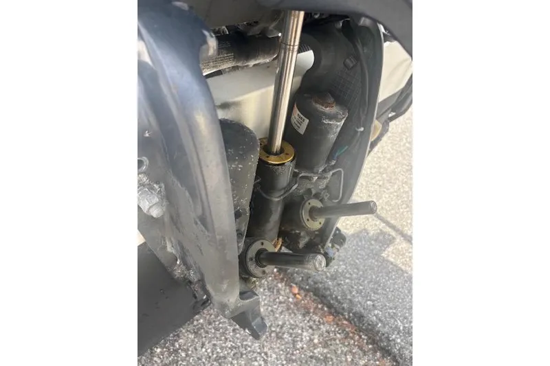 Slide: The Image of Close-up of a 1998 Mako 221 Center Console boat engine component. - 4