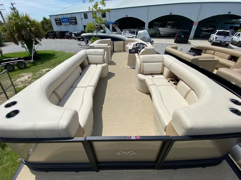 Slide: The Image of Luxurious 2021 Harris 250 Cruiser pontoon boat with spacious seating and modern design. - 6