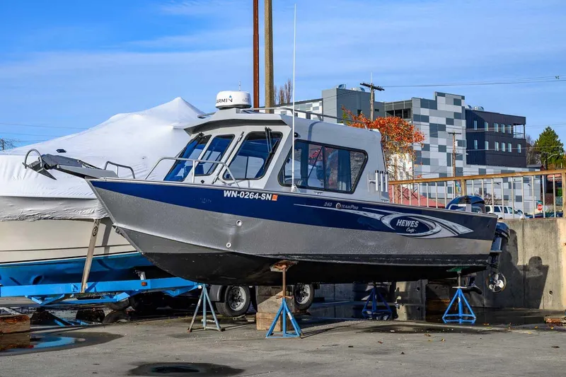 The Image of 2017 Hewescraft 240 Ocean Pro boat on stands, urban background. - 1