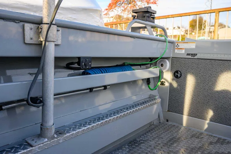 Slide: The Image of 2017 Hewescraft 240 Ocean Pro boat interior with storage and utility features. - 12