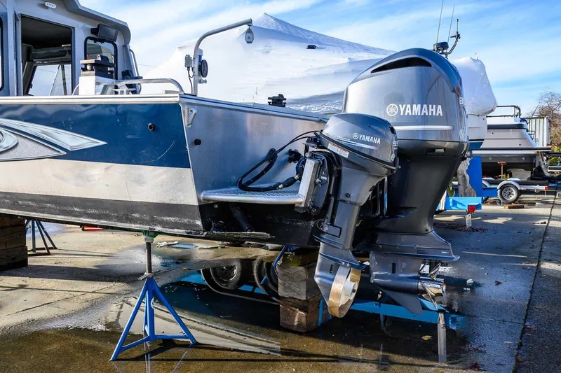 Slide: The Image of 2017 Hewescraft 240 Ocean Pro with Yamaha outboard engines on a boatyard stand. - 16