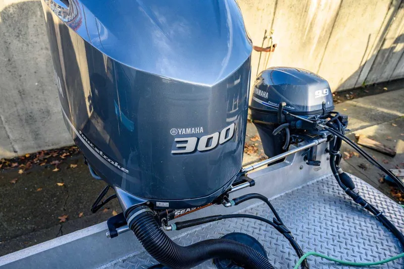 Slide: The Image of Yamaha 300 and 9.9 outboard motors on 2017 Hewescraft 240 Ocean Pro boat. - 17