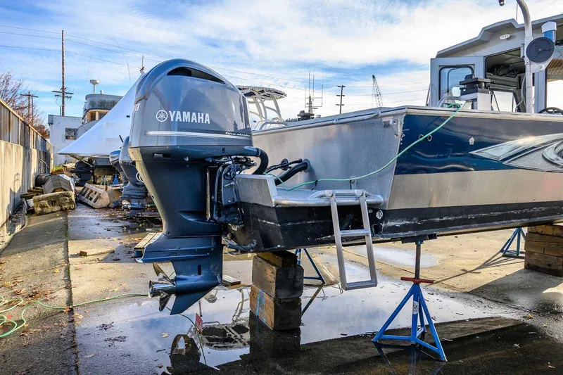 Slide: The Image of 2017 Hewescraft 240 Ocean Pro with Yamaha outboard motor on a boatyard. - 19
