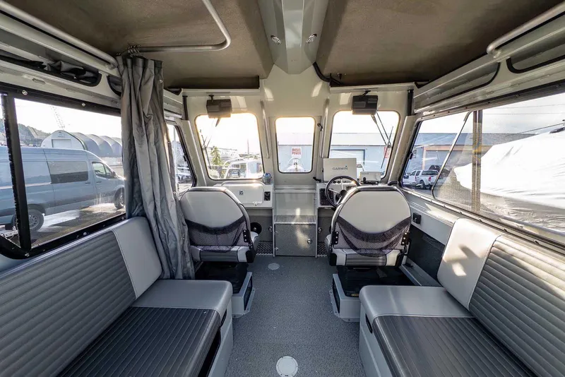 Slide: The Image of Interior of 2017 Hewescraft 240 Ocean Pro boat with seating and steering console. - 20