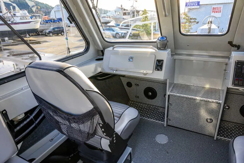 Slide: The Image of 2017 Hewescraft 240 Ocean Pro boat interior with seating and control panel. - 22