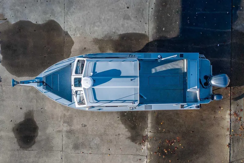 Slide: The Image of Overhead view of 2017 Hewescraft 240 Ocean Pro boat on concrete surface. - 3