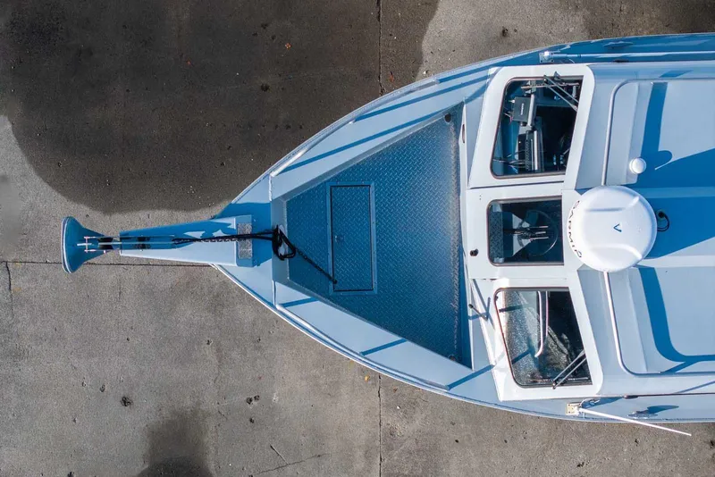Slide: The Image of Aerial view of 2017 Hewescraft 240 Ocean Pro boat docked on concrete surface. - 4