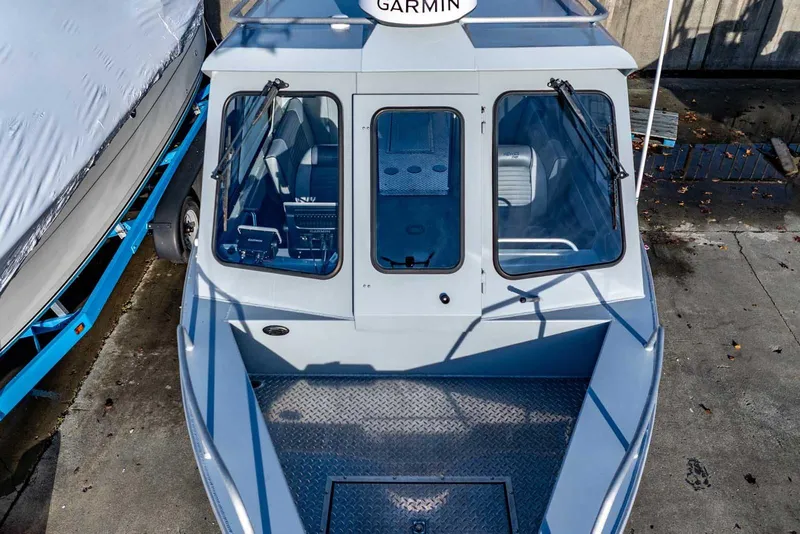 Slide: The Image of 2017 Hewescraft 240 Ocean Pro boat with Garmin equipment, docked and viewed from above. - 6