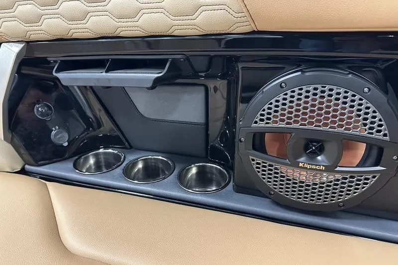 Slide: The Image of Interior of 2025 MasterCraft XT24 boat with Klipsch speaker and cup holders. - 18