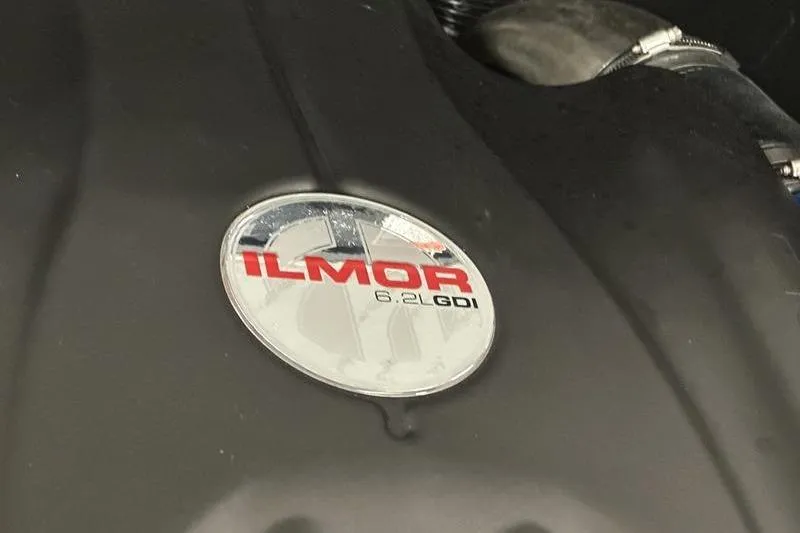 Slide: The Image of Close-up of Ilmor 6.2L GDI engine badge on 2025 MasterCraft XT24. - 25