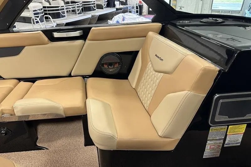 Slide: The Image of 2025 MasterCraft XT24 interior with beige leather seating and modern design. - 33