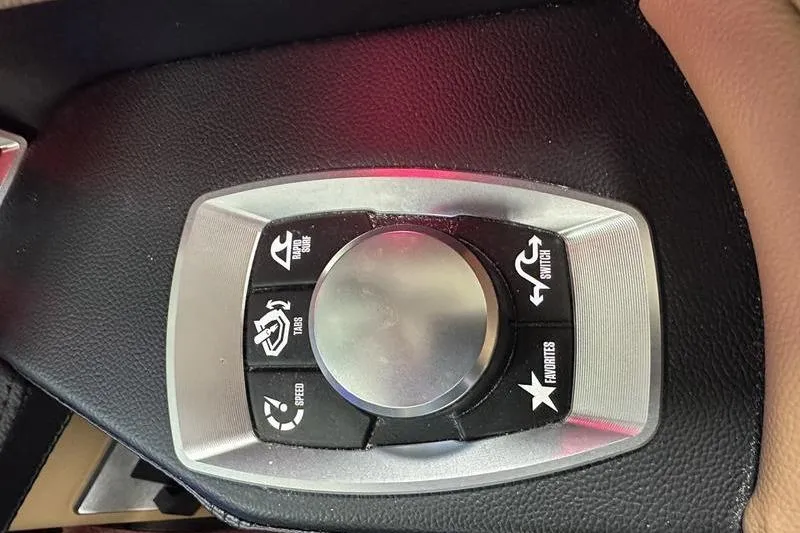 Slide: The Image of Control panel of 2025 MasterCraft XT24 boat with various function buttons. - 44