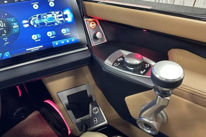 Slide: The Image of 2025 MasterCraft XT24 dashboard with touchscreen controls and modern steering features. - 45