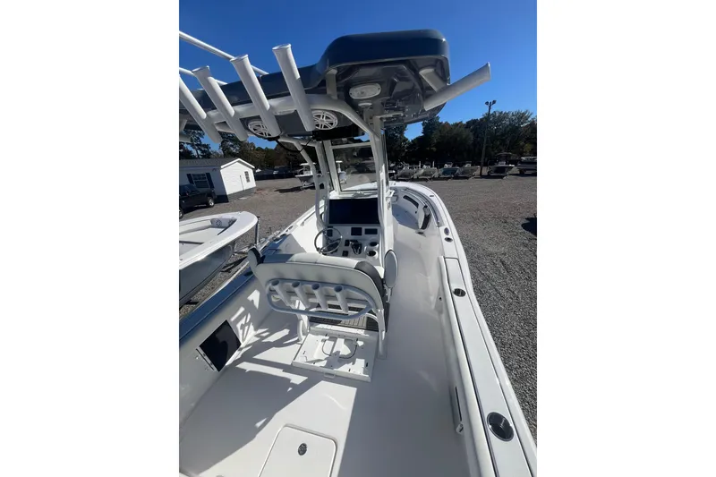 Slide: The Image of 2026 Tidewater 232 CC Adventure boat deck with storage hatch and fittings. - 12