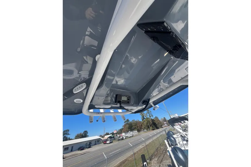 Slide: The Image of 2026 Tidewater 232 CC Adventure boat with Yamaha 300 V6 engine, parked outdoors. - 6