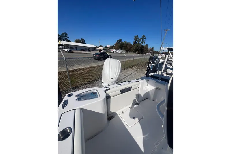 Slide: The Image of 2026 Tidewater 232 CC Adventure boat logo on sleek gray hull. - 8