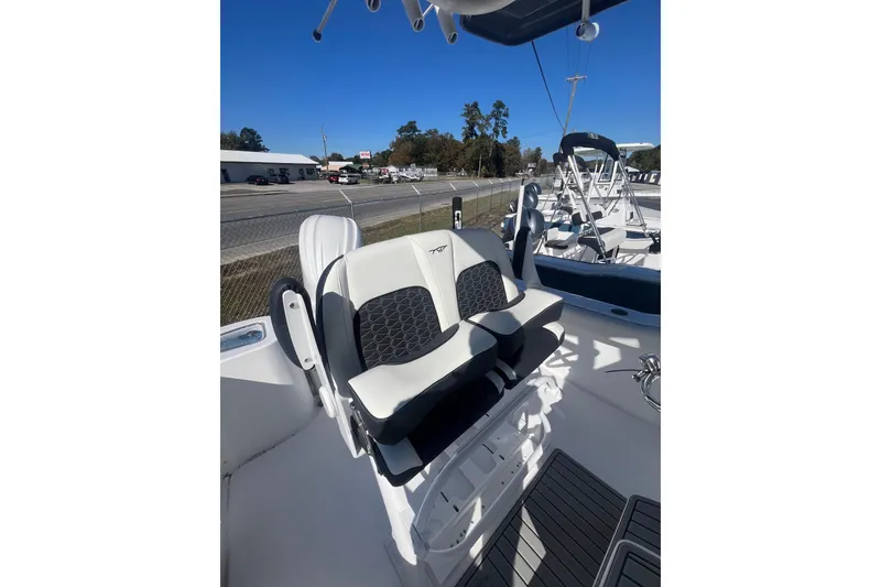 Slide: The Image of Yamaha engine on 2026 Tidewater 232 CC Adventure boat under clear blue sky. - 9