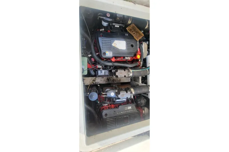 Slide: The Image of Engine compartment of a 2008 Cruisers 330 boat, featuring dual Volvo Penta engines. - 7