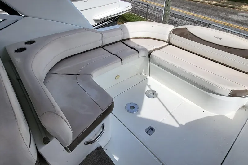 Slide: The Image of Luxurious seating area on a 2008 Cruisers 330 yacht, featuring comfortable white cushions. - 18