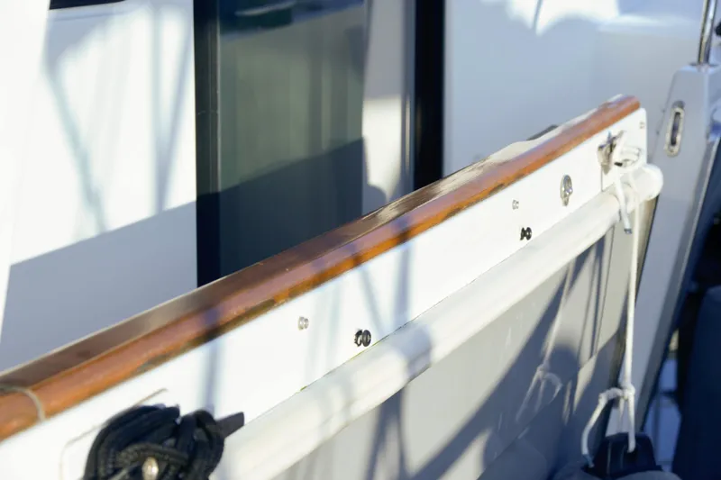 Slide: The Image of Interior of 2013 Beneteau Swift Trawler 34 Fly, featuring helm and galley area. - 12