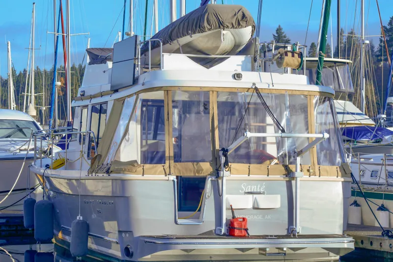 Slide: The Image of Interior of 2013 Beneteau Swift Trawler 34 Fly, featuring cozy dining area and helm station. - 13
