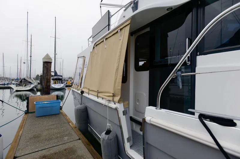 Slide: The Image of Interior of 2013 Beneteau Swift Trawler 34 Fly with seating and storage drawers. - 15