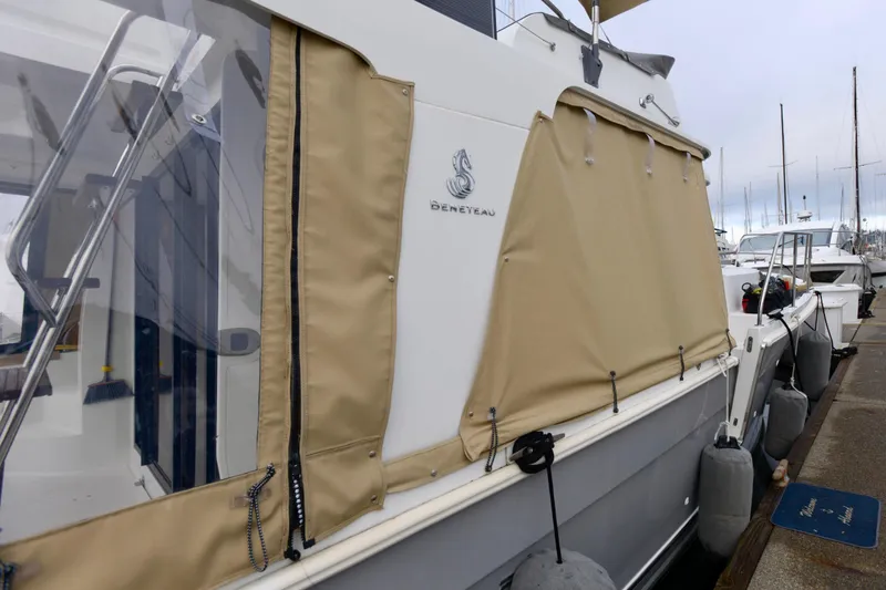 Slide: The Image of Interior of 2013 Beneteau Swift Trawler 34 Fly with wooden flooring and seating. - 16