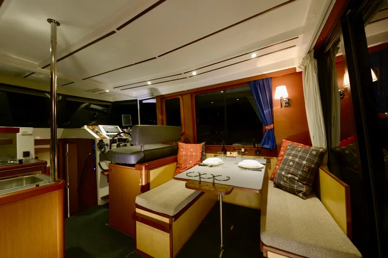 Slide: The Image of 2013 Beneteau Swift Trawler 34 Fly interior with open hatch and wooden steps. - 27