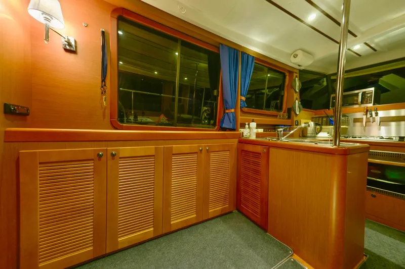 Slide: The Image of 2013 Beneteau Swift Trawler 34 Fly, side deck view with orange canvas cover. - 31