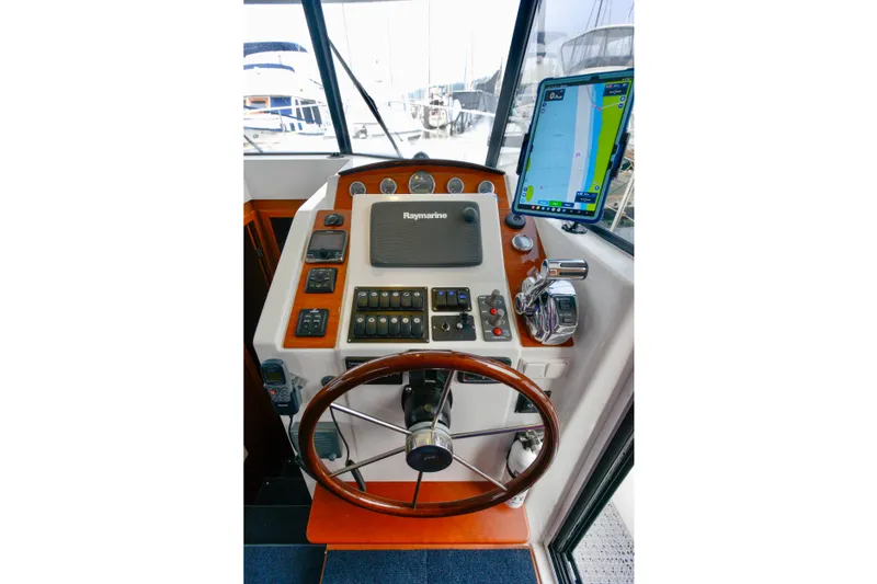 Slide: The Image of 2013 Beneteau Swift Trawler 34 Fly deck view with seating and equipment. - 34