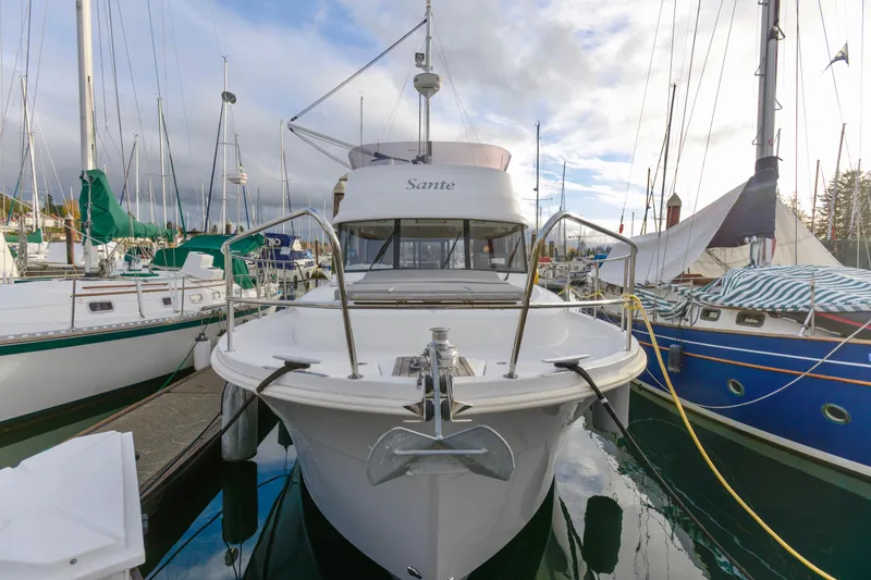 Slide: The Image of 2013 Beneteau Swift Trawler 34 Fly with dinghy on open water. - 4