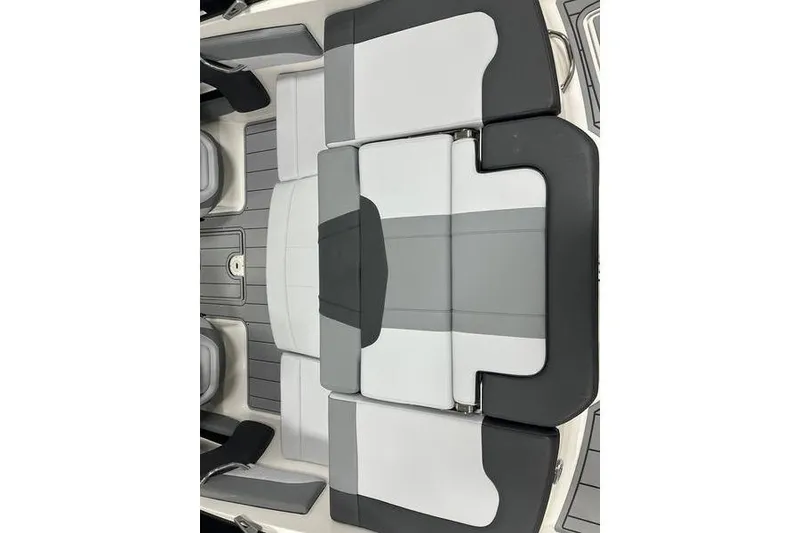 Slide: The Image of 2026 Chaparral 21 SSi boat interior with sleek, modern seating design in gray and black. - 11