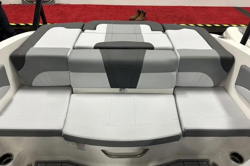Slide: The Image of 2026 Chaparral 21 SSi boat interior with gray and white cushioned seating. - 13
