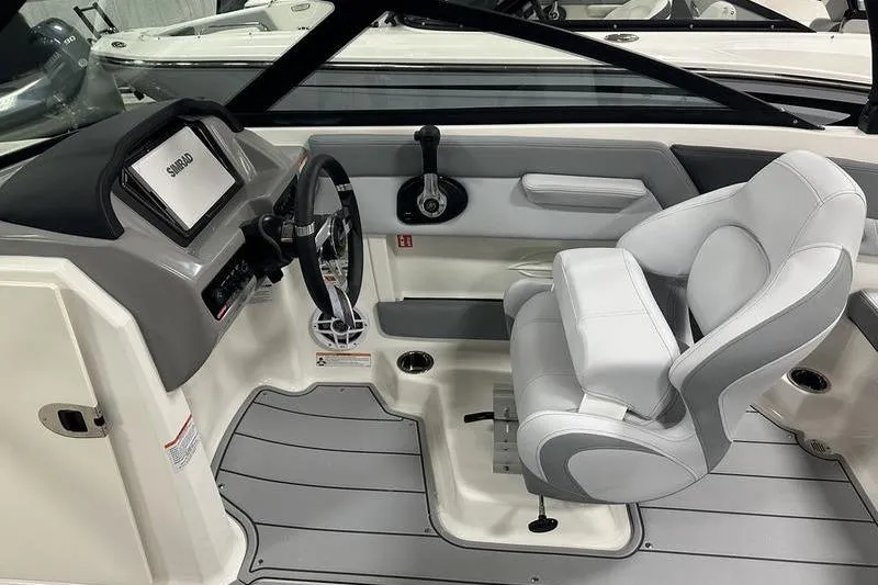 Slide: The Image of 2026 Chaparral 21 SSi boat interior with steering wheel and modern dashboard. - 17