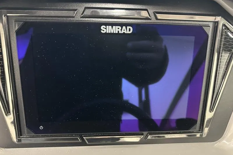 Slide: The Image of Simrad display screen on 2026 Chaparral 21 SSi boat dashboard. - 19
