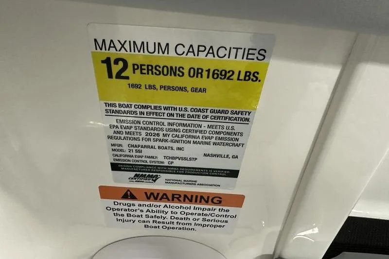 Slide: The Image of Chaparral 21 SSi 2026 boat capacity label: 12 persons or 1692 lbs, safety warning included. - 20